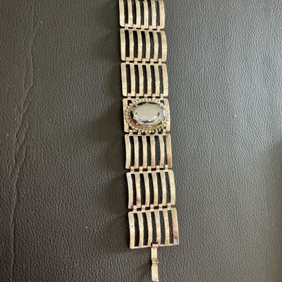 Sale Photo Thumbnail #163: Silver Tone ladder link statement bracelet with mirrored hematite style stone has wearing blemishes 
Please see attached pictures