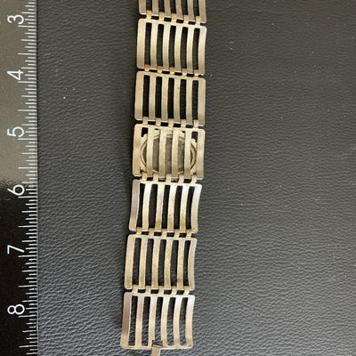 Sale Photo Thumbnail #169: Silver Tone ladder link statement bracelet with mirrored hematite style stone has wearing blemishes 
Please see attached pictures