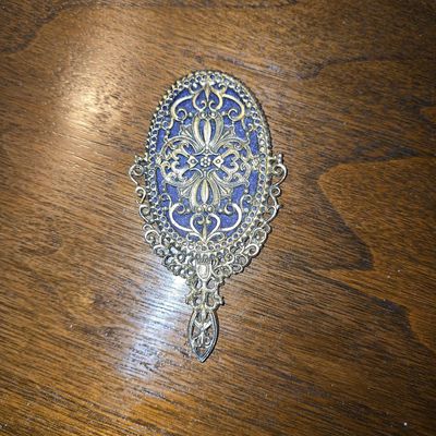 Sale Photo Thumbnail #842: Vintage Ornate Filigree Hand Mirror with Blue Inlay