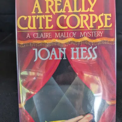 Joan Hess A Really Cute Corpse - 1988 First Edition HC