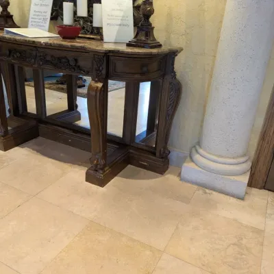 Sale Photo Thumbnail #54: Large ornate console or entry table featuring a stone or marble-style top, carved wood base, decorative drawer fronts, and substantial turned legs. Designed as a statement foyer piece and formerly used in an upscale clubhouse setting. 68"w*28"d*37"h