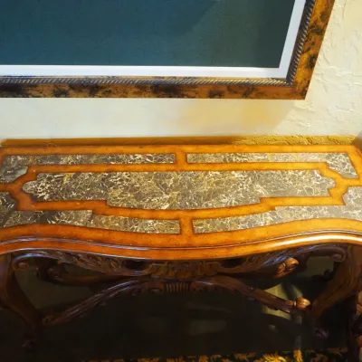 Sale Photo Thumbnail #151: Substantial traditional console table featuring extensive carved scroll and leaf detailing, shaped legs, and a decorative lower stretcher. Rich wood finish and architectural styling make this an attractive foyer, sofa, or hallway piece. 58"wx20"d*33.5h
