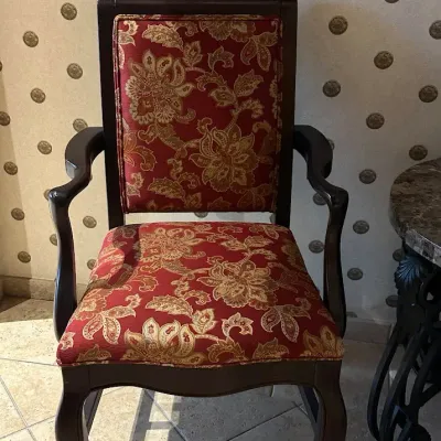 Sale Photo Thumbnail #129: Classic wood-frame armchair with curved arms and red-and-gold floral upholstery. Comfortable occasional or dining-style chair with understated traditional lines. 23.5x22 deep