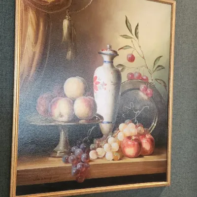 Sale Photo Thumbnail #69: Traditional still life depicting fruit, grapes, and decorative vessels, dramatically presented with an oversized deep-green surround and antiqued decorative frame. 60.5*70.5