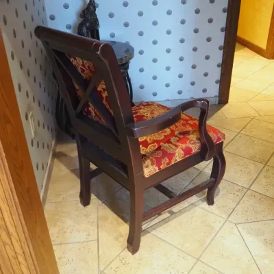 Sale Photo Thumbnail #130: Classic wood-frame armchair with curved arms and red-and-gold floral upholstery. Comfortable occasional or dining-style chair with understated traditional lines. 23.5x22 deep