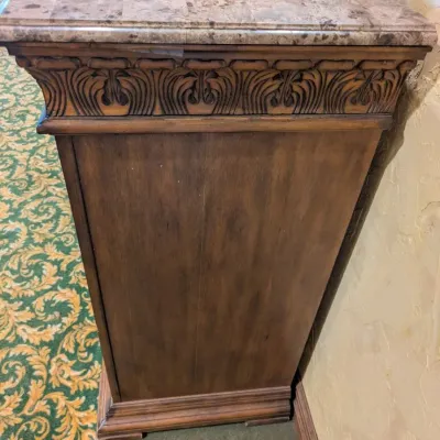 Sale Photo Thumbnail #38: Large traditional-style wood cabinet featuring deeply carved doors, decorative trim, upper drawers, and substantial molding throughout. Rich warm finish with an impressive architectural look. Ideal as a bar cabinet, storage cabinet, entry piece, or statem