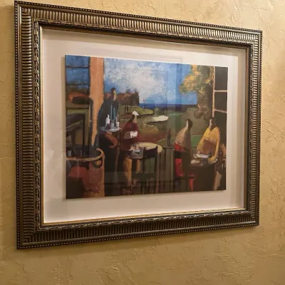 Sale Photo Thumbnail #83: Framed contemporary golf-themed artwork depicting figures overlooking a course from a clubhouse or terrace setting. Rich colors and abstract painterly styling, professionally presented in an ornate coordinating frame. 42*36