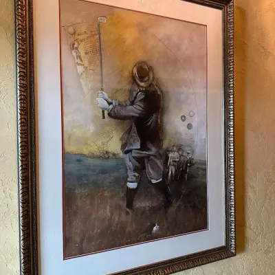 Sale Photo Thumbnail #77: You are bidding on a set of 4 items. Large framed golf artwork depicting a traditionally dressed early-era golfer with clubs and period-inspired graphic elements. Warm sepia and golden tones, professionally matted, and presented in an ornate antiqued fram