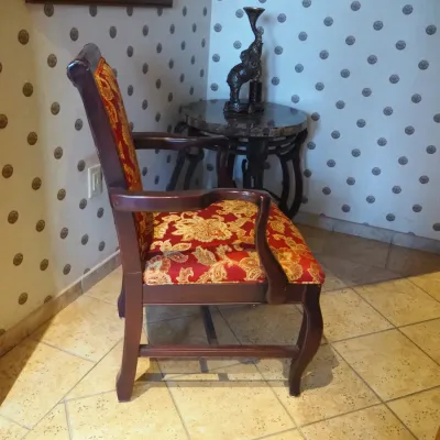 Sale Photo Thumbnail #128: Classic wood-frame armchair with curved arms and red-and-gold floral upholstery. Comfortable occasional or dining-style chair with understated traditional lines. 23.5x22 deep