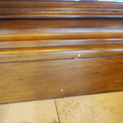 Sale Photo Thumbnail #50: Large ornate console or entry table featuring a stone or marble-style top, carved wood base, decorative drawer fronts, and substantial turned legs. Designed as a statement foyer piece and formerly used in an upscale clubhouse setting. 68"w*28"d*37"h