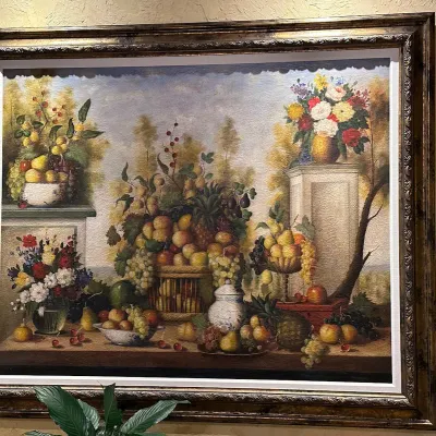 Sale Photo Thumbnail #63: Impressive oversized traditional still life featuring abundant fruit and floral arrangements in an ornate antiqued frame with decorative inner molding. Rich Old World palette and substantial scale make this a strong statement piece. Over 70" w and over 60