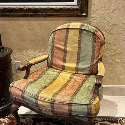 Sale Photo Thumbnail #140: You are bidding on a pair of these comfortable traditional lounge chair featuring multicolor muted stripe upholstery, exposed wood arms, and curved wood legs. Generously proportioned with a relaxed clubhouse look. 35"*40"*35w