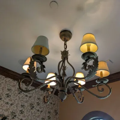 Sale Photo Thumbnail #91: Substantial traditional chandelier featuring scrolling metal arms, dimensional leaf detailing, and coordinating fabric shades. Antiqued bronze/gold finish with elegant Old World design. Buyer responsible for removal. Approx 38" round