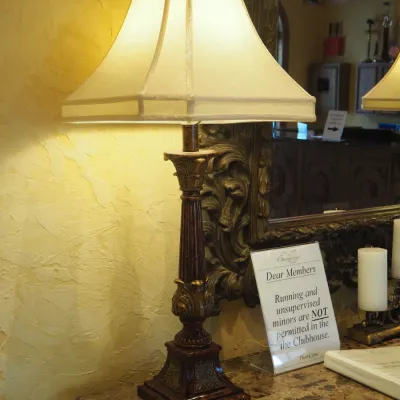 Sale Photo Thumbnail #94: You are bidding on the pair. Coordinating pair of tall traditional table lamps featuring fluted column bases, ornate acanthus-style detailing, antiqued finish, and tailored fabric shades. Substantial decorator-quality lamps ideal for a console, buffet, or