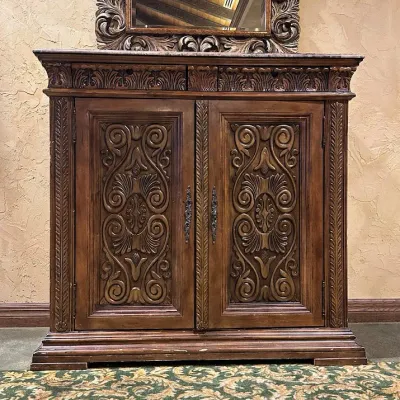 Sale Photo Thumbnail #31: Large traditional-style wood cabinet featuring deeply carved doors, decorative trim, upper drawers, and substantial molding throughout. Rich warm finish with an impressive architectural look. Ideal as a bar cabinet, storage cabinet, entry piece, or statem