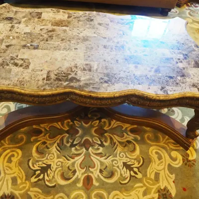 Sale Photo Thumbnail #157: Impressive oversized coffee table featuring a shaped natural-stone-style top composed of richly varied tiles over an extensively carved wood base. Scalloped edges, carved apron, substantial legs, and dramatic stretcher base create a true statement piece. 
