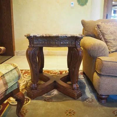 Sale Photo Thumbnail #162: Substantial traditional end table featuring a shaped polished stone top and coordinating carved wood base with scroll legs and architectural stretcher. Designed to coordinate with the larger stone-top coffee table. 26*29*28.5h
