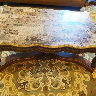 Sale Photo Thumbnail #156: Impressive oversized coffee table featuring a shaped natural-stone-style top composed of richly varied tiles over an extensively carved wood base. Scalloped edges, carved apron, substantial legs, and dramatic stretcher base create a true statement piece. 