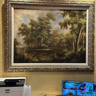 Sale Photo Thumbnail #71: Oversized atmospheric landscape depicting a wooded water scene with lush vegetation and dramatic natural light. Substantial ornate frame and large scale make this a strong executive office or residential statement piece.