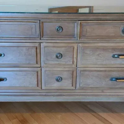 Elegant Grey Wood 9-Drawer Dresser with Glass Top Protector