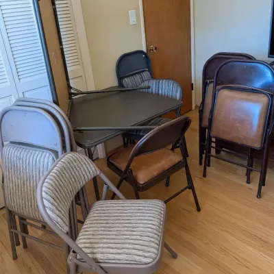 Cushioned Folding Chair Lot with 2 Card Tables -  9 Chairs Total