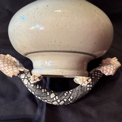 Sale Photo Thumbnail #24: Bill Campbell is known for his porcelain vessels & layered glazes. This vase features flowers as well as snake skin depiction.
