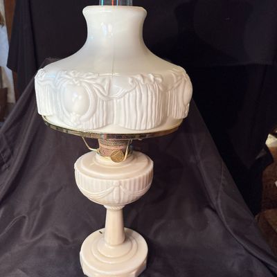 Sale Photo Thumbnail #211: This is a vintage Aladdin Tall Lincoln Drape mantle lamp in ivory Alacite glass, featuring a Nu-Type Model B burner. 26h x 11w.