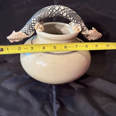 Sale Photo Thumbnail #28: Bill Campbell is known for his porcelain vessels & layered glazes. This vase features flowers as well as snake skin depiction.