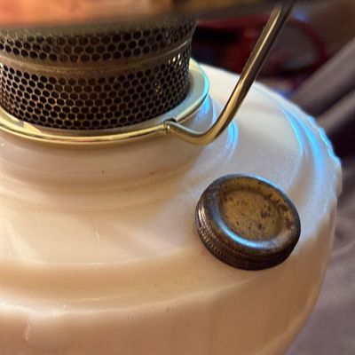 Sale Photo Thumbnail #216: This is a vintage Aladdin Tall Lincoln Drape mantle lamp in ivory Alacite glass, featuring a Nu-Type Model B burner. 26h x 11w.