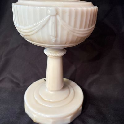 Sale Photo Thumbnail #214: This is a vintage Aladdin Tall Lincoln Drape mantle lamp in ivory Alacite glass, featuring a Nu-Type Model B burner. 26h x 11w.
