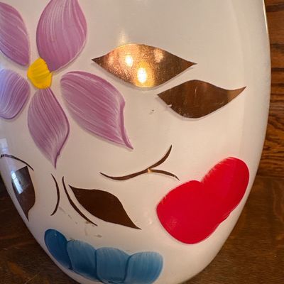 Sale Photo Thumbnail #688: This is a vintage mid-20th-century Bartlett-Collins milk glass cookie jar featuring hand-painted floral and fruit motifs, 1950s. Approx 10” high
