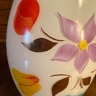 Sale Photo Thumbnail #687: This is a vintage mid-20th-century Bartlett-Collins milk glass cookie jar featuring hand-painted floral and fruit motifs, 1950s. Approx 10” high