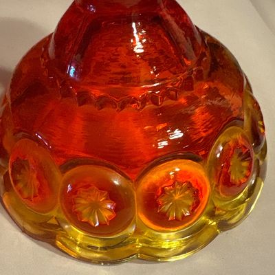 Sale Photo Thumbnail #658: vintage L.E. Smith Glass Co. Amberina "Moon and Stars" pattern candlestick holders, measuring approximately 4.5 inches tall.