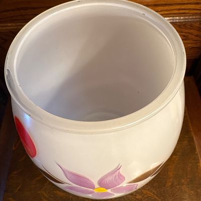 Sale Photo Thumbnail #690: This is a vintage mid-20th-century Bartlett-Collins milk glass cookie jar featuring hand-painted floral and fruit motifs, 1950s. Approx 10” high
