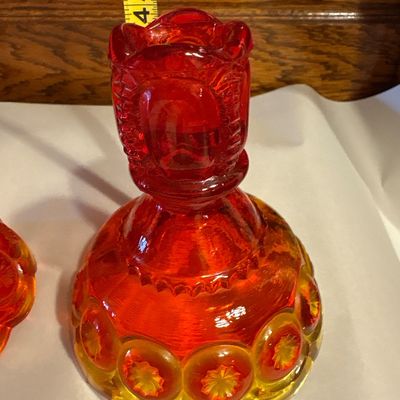 Sale Photo Thumbnail #659: vintage L.E. Smith Glass Co. Amberina "Moon and Stars" pattern candlestick holders, measuring approximately 4.5 inches tall.