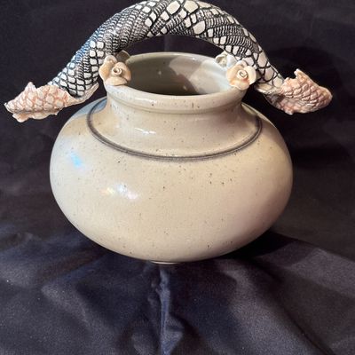Sale Photo Thumbnail #26: Bill Campbell is known for his porcelain vessels & layered glazes. This vase features flowers as well as snake skin depiction.