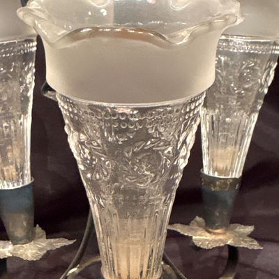Sale Photo Thumbnail #567: antique Edwardian/Art Nouveau silver-plated epergne (table centerpiece) dating to around 1900, featuring a hammered metal base with scroll arms and four frosted, fluted glass trumpets or bud vases