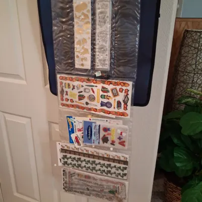 HANGING SCRAPBOOK ORGANIZER FILLED WITH SUPPLIES