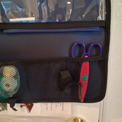 HANGING SCRAPBOOK ORGANIZER FILLED WITH SUPPLIES