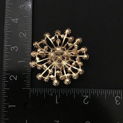 Gold tone fashion brooch