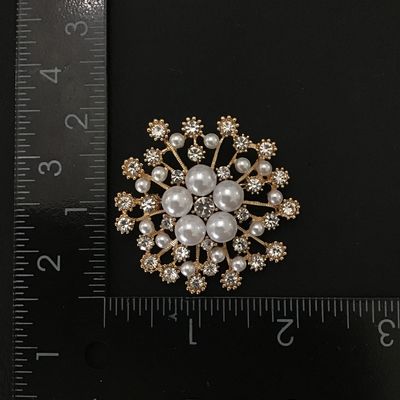 Gold tone fashion brooch