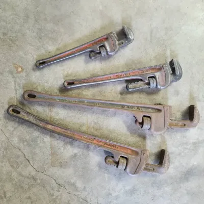 Lot of 4 Vintage RIDGID and Craftsman Heavy-Duty Cast-Iron Pipe Wrenches (14", 18", 24")