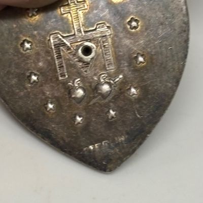 LOT 66: Sterling Miraculous Medal on Mother of Pearl Heart Pendant 7.6gtw (Silver-Tone Chain) with Sterling and Marcasite Miraculous...