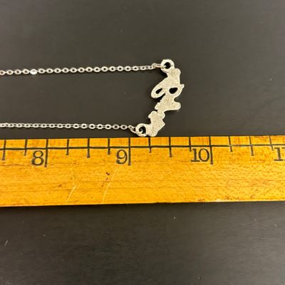 LOT 65: Sterling Silver Winnie the Pooh Pendant on Silver-Tone Chain, Mickey Mouse Watch & Bugs Bunny Necklace and Pin