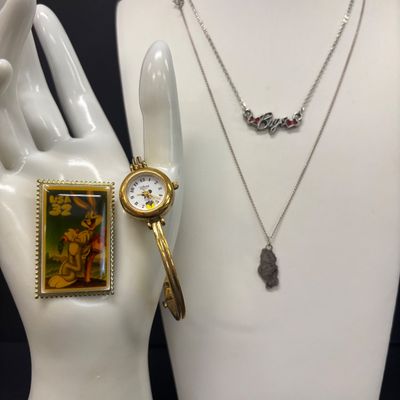 LOT 65: Sterling Silver Winnie the Pooh Pendant on Silver-Tone Chain, Mickey Mouse Watch & Bugs Bunny Necklace and Pin