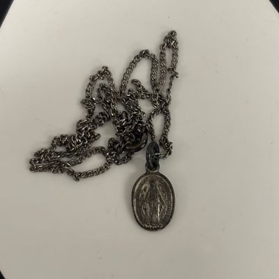 LOT 66: Sterling Miraculous Medal on Mother of Pearl Heart Pendant 7.6gtw (Silver-Tone Chain) with Sterling and Marcasite Miraculous...