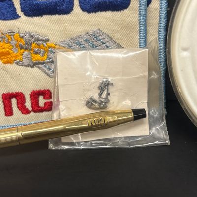 LOT 73: Vintage RCA Memorabilia: Patches, Tie Tacks, Tie Clips, Lapel Pins, Coasters, Pen