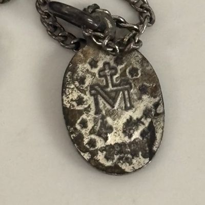 LOT 66: Sterling Miraculous Medal on Mother of Pearl Heart Pendant 7.6gtw (Silver-Tone Chain) with Sterling and Marcasite Miraculous...