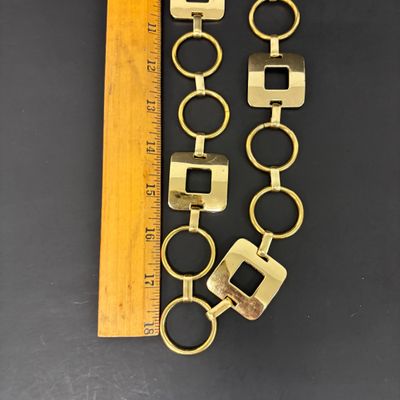 LOT 41: Vintage Belts, Red Enamel Costume Jewelry, Cat-Themed Ashtray and Pin & More