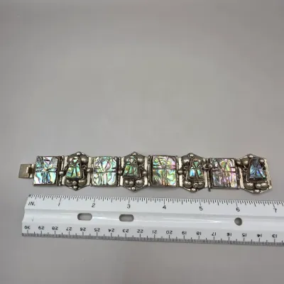 LOT 55: Two Pairs of Vintage Sterling Silver Earrings (13.6gtw) and an Aztec Panel Bracelet with Inlaid Abalone